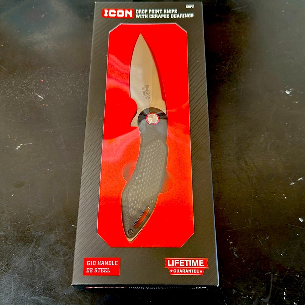 Icon drop point knife with ceramic bearings